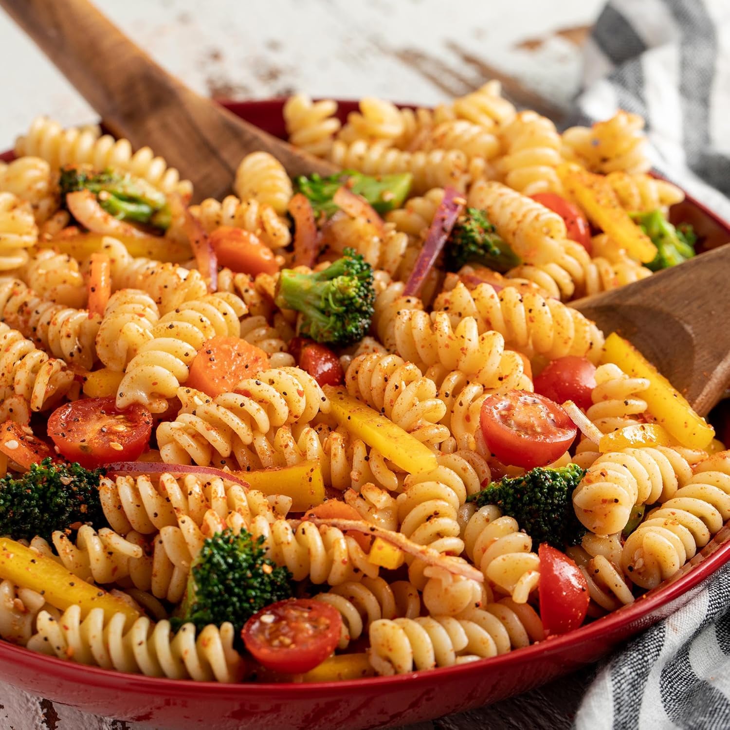 adds visible color flecks (poppy seeds, spices) as a garnish-quality finish