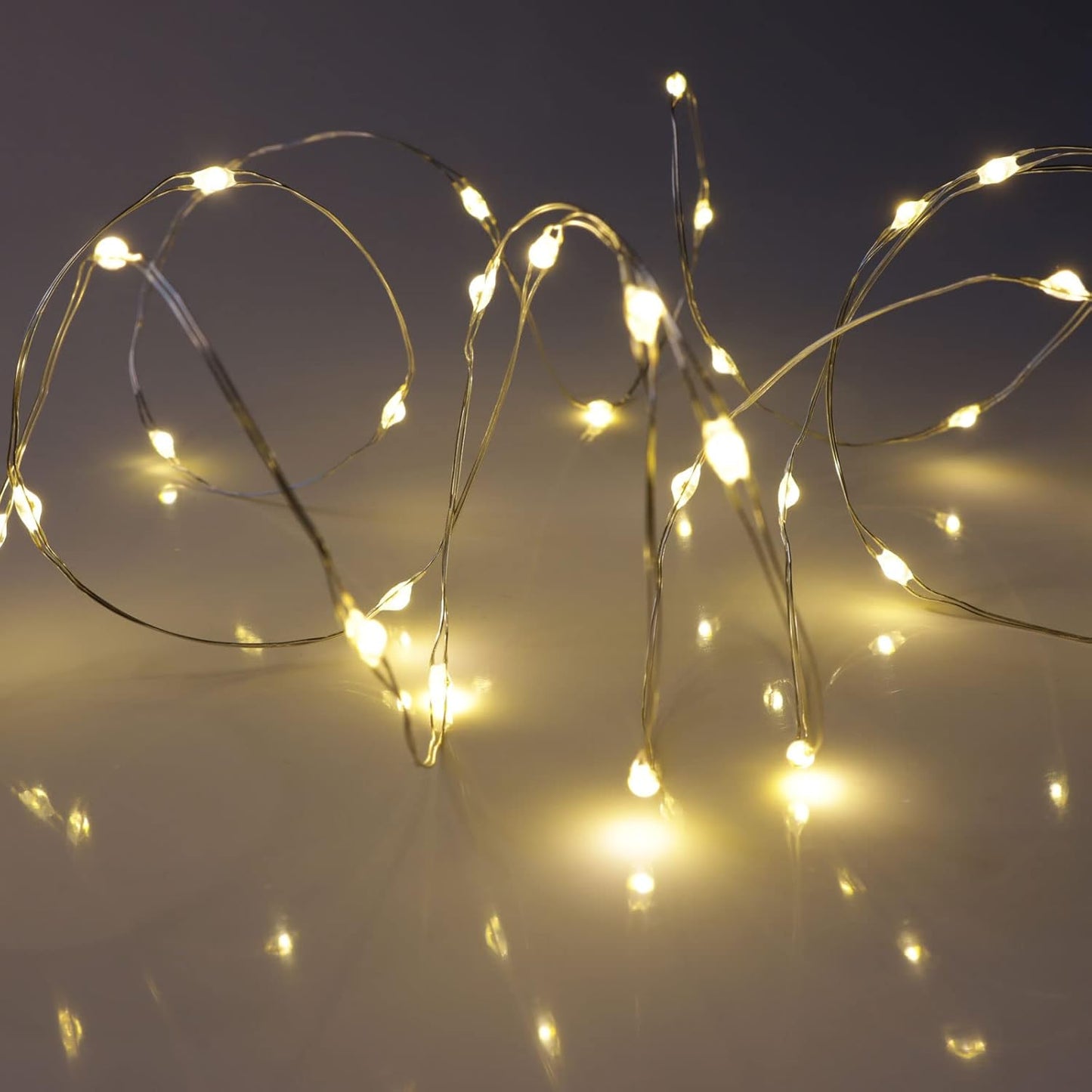 QBIS Warm White Fairy Lights – Battery Operated 6.5ft Silver Wire for Cozy Bedroom Shelf and Headboard Accent Lighting
